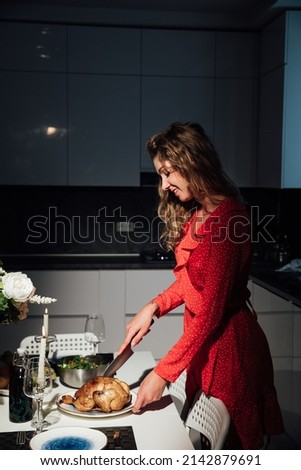 woman cooks a romantic dinner in the kitchen