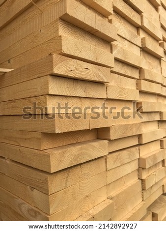 stack of wood. Timber construction material.  Royalty-Free Stock Photo #2142892927