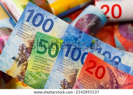 Swiss franc banknotes of various denominations, placed next to each other. CHF paper money, edition of Swiss banknotes, issued from April 2016 to 2019.