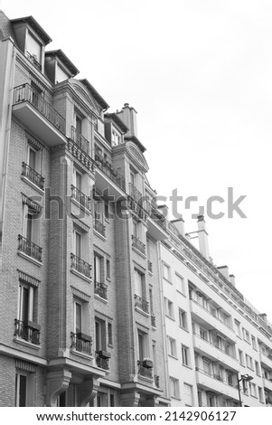 Houses on the street of the city. Black and white photography.