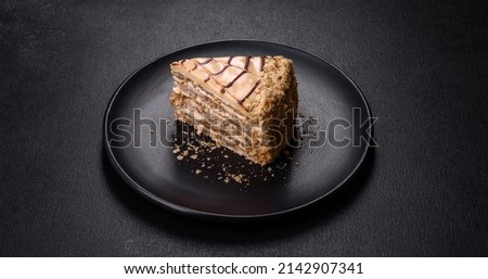 Traditional Hungarian Esterhazy cake, torte. Black background. Copy space