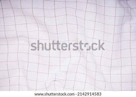 Close-up of vintage checkered towel - textured background, top view.