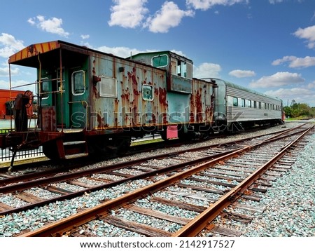a vintage retired old train railroad card rusty caboose lounge car rusted abandoned empty rail machine Royalty-Free Stock Photo #2142917527