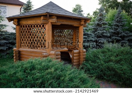 wooden house in the woods in the park Royalty-Free Stock Photo #2142921469