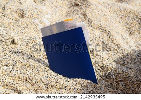 passport, credit card and plane ticket on the background of the beach