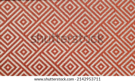 Close up of a diamond fabric pattern on upholstery