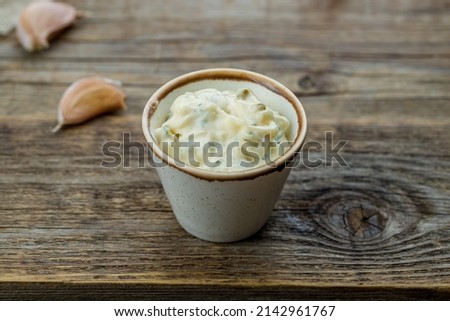 tar-tar sauce in a saucepan on old wooden table Royalty-Free Stock Photo #2142961767