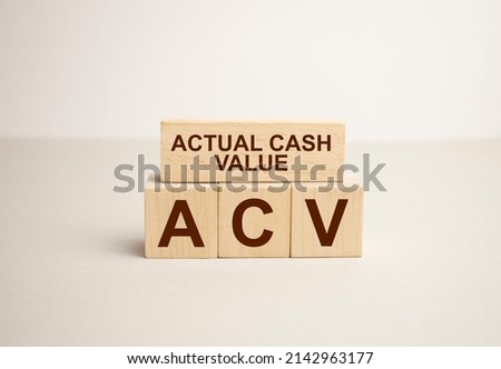 aba is made up of wooden cubes that stand on a burgundy notebook near the pen. Business concept Royalty-Free Stock Photo #2142963177