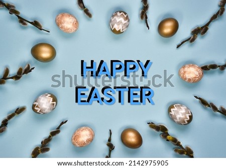 Happy Easter. Painted eggs with pussy willow on blue background. Easter composition. Flat lay. Greeting card for holiday. Banner 