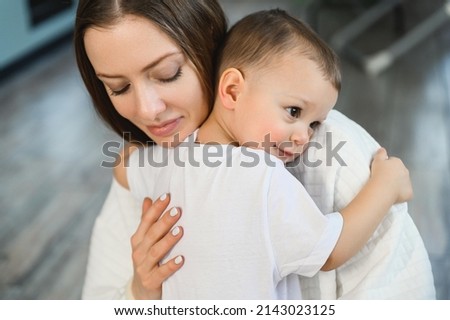 Portrait of a loving caring mother and a one and a half year old child. Motherhood is the highest manifestation of love