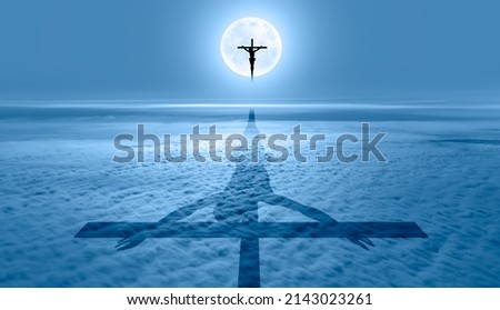 Jesus on the cross over the clouds with full moon, jesus shadow on the clouds "Elements of this image furnished by NASA"
