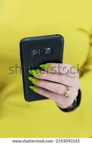 Woman's hands holding a smartphone