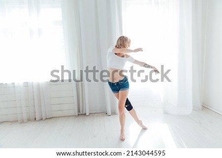 woman listens to music songs and dances