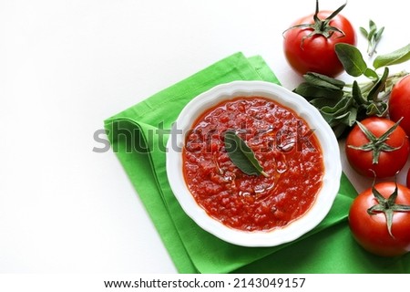 Homemade tomato sauce and fresh tomato isolated on white background. Directly above, copy space.