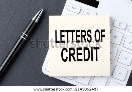 Text LETTER OF CREDIT on a sticker on the calculator, business concept