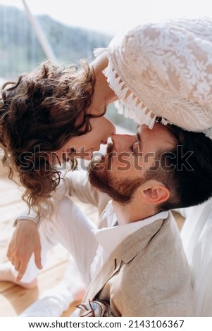 Bride and groom are kissing. Eco wedding in bogo and lifestyle.  Royalty-Free Stock Photo #2143106367