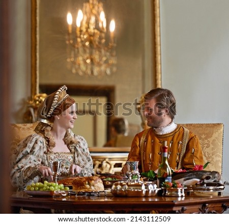 High tea with the Duchess. A regal king and queen enjoying a meal together.