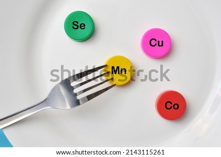 Icons of minerals and macronutrients on a plate. Selection of foods with a high content of vitamins and trace elements Royalty-Free Stock Photo #2143115261