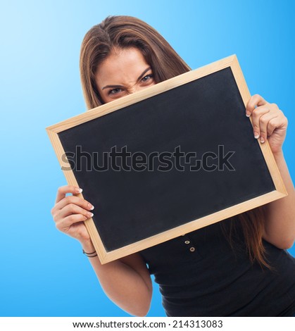 portrait of a girl behind of a chalkboard