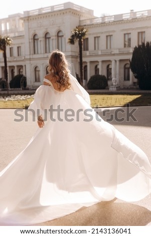 Long flowing wedding dress of the bride.