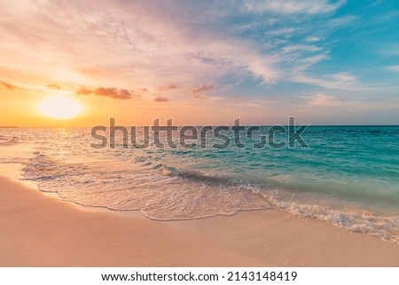 Closeup sea sand beach. Panoramic beach landscape. Inspire tropical beach seascape horizon. Orange and golden sunset sky calmness tranquil relaxing sunlight summer mood. Vacation travel holiday banner Royalty-Free Stock Photo #2143148419