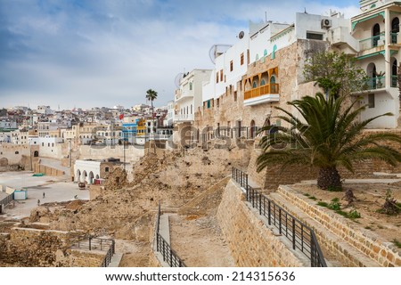 Ancient walls and living houses in Medina. Tangier, Morocco Royalty-Free Stock Photo #214315636