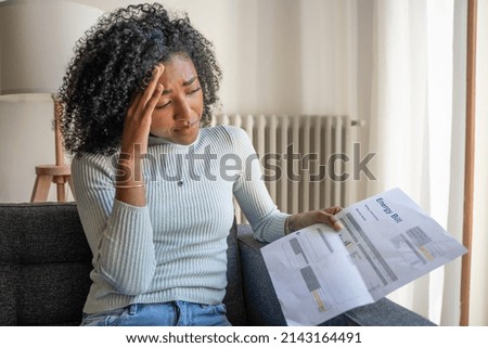 One black woman having problem paying energy bill expenses Royalty-Free Stock Photo #2143164491