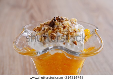 A La carte dessert orange color with cream and nuts