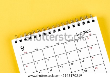 Close-up September 2022 desk calendar on yellow background. Royalty-Free Stock Photo #2143170219