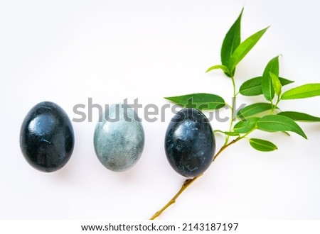 Dark blue Easter eggs on gray background