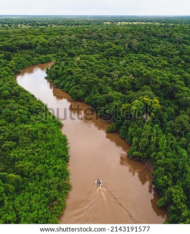 Pantanal by Drone, the biggest savanna in the world -  Mato grosso do sul, boat in the river and big mountains . Royalty-Free Stock Photo #2143191577