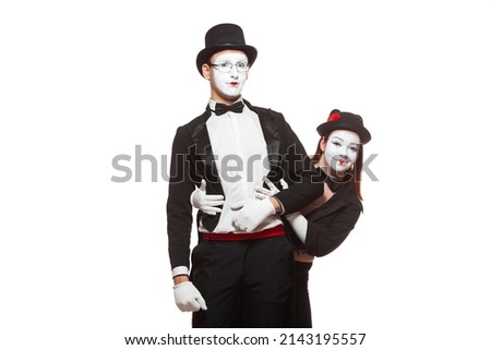 Portrait of two mime artists performing, isolated on white background. Symbol of meeting, unexpected appearance, friendship, embarrassment