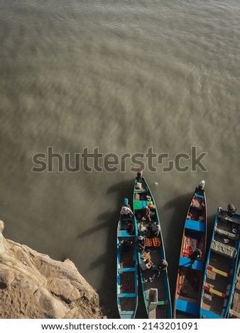 Bird eye view of local fishing boats parking at a dock. Colorful fishing boats from top view