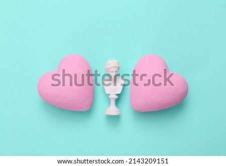 Venus bust with hearts on a turquoise background. Love, Valentine's Day February 14 concept. flat lay