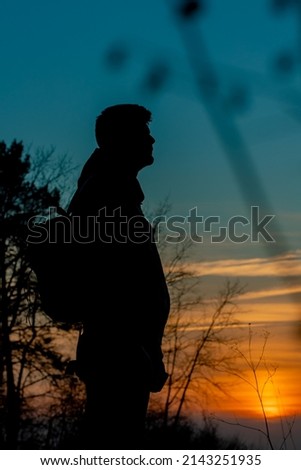 shadow of a man on the background of the patriotic sunset in Ukraine