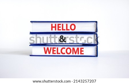 Hello and welcome symbol. Concept words Hello and welcome on books. Beautiful white table white background. Business hello and welcome concept. Copy space.