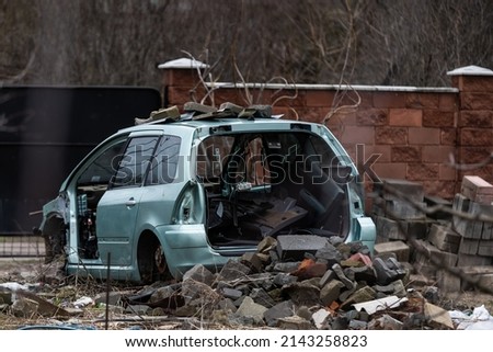 Heap of old rusty disassembled car parts at workshop waste storage hangar indoor. Vehicle salvage dismantling garage. Iron auto spare details trunk pile for recycling at scrap junkyard Royalty-Free Stock Photo #2143258823