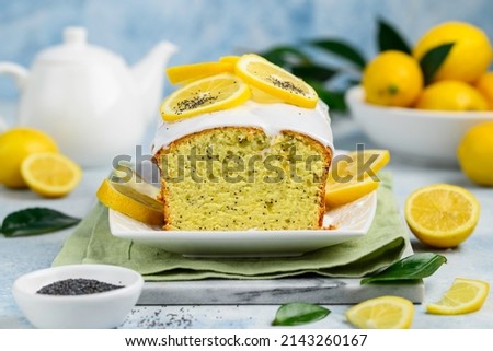Lemon curd cake with poppy seeds on a white dish. Citrus fruit bakery. Selective focus