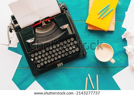 Top view of writer's block concept with vintage classic typewriter on author's desk, copy space included Royalty-Free Stock Photo #2143277737
