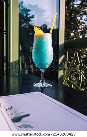 Tropical cocktails with pineapple and straw in glasses. Pina colada. Blue Curacao. High quality photo