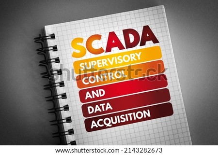 SCADA - Supervisory Control And Data Acquisition acronym on notepad, technology concept background