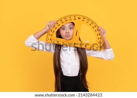 funny teen girl in school uniform hold mathematics protractor for measuring, logic