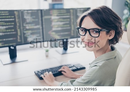 Photo of pretty positive lady sitting chair typing keyboard look camera good mood office workplace