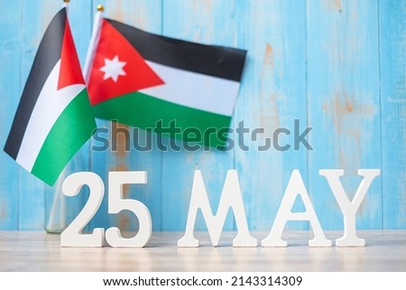 Wooden text of May 25th with Jordan flags. Jordan Independence day and happy celebration concepts