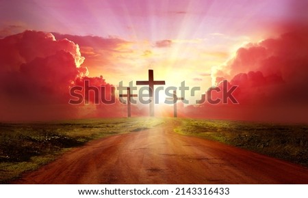 Red  sky at sunset. Beautiful landscape with road   leads up to cross. Religion concept.Christianity background Royalty-Free Stock Photo #2143316433