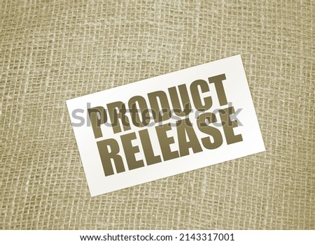 NEW RELEASE text on card on burlap canvas. business startup concept.