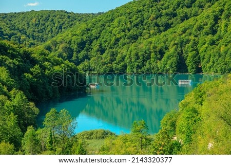 Kozjak lake with ferry boats overlook on Plitvice Lakes National Park of Croatia. Natural forest park with lakes and waterfalls in Lika region. UNESCO World Heritage of Croatia named Plitvicka Jezera Royalty-Free Stock Photo #2143320377