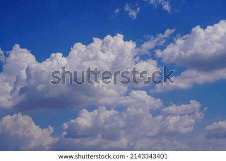 Blue sky with white clouds. Sky and clouds during the daytime in the summer. white fluffy clouds in the blue sky.                               
