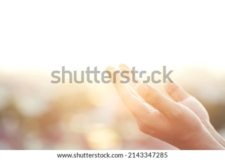Human hands open palm up worship Praying with faith and belief in God of an appeal to the sky. Concept Religion and spirituality with believe Power of hope or love and devotion. filler tone vintage. Royalty-Free Stock Photo #2143347285