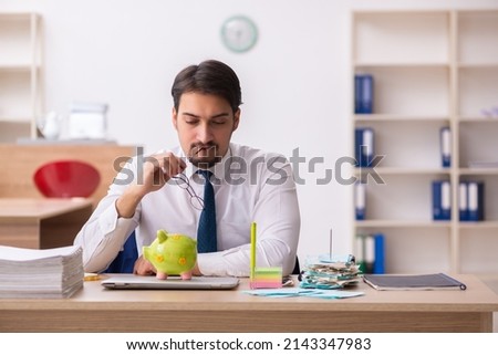 Young male bookkeeper in pension concept Royalty-Free Stock Photo #2143347983